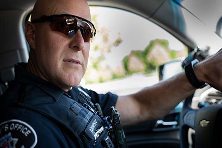 Police officer on patrol with field response app