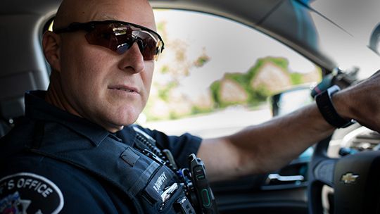 Police officer on patrol with field response app